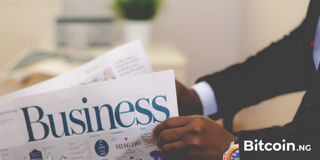 black man reading bitcoin news